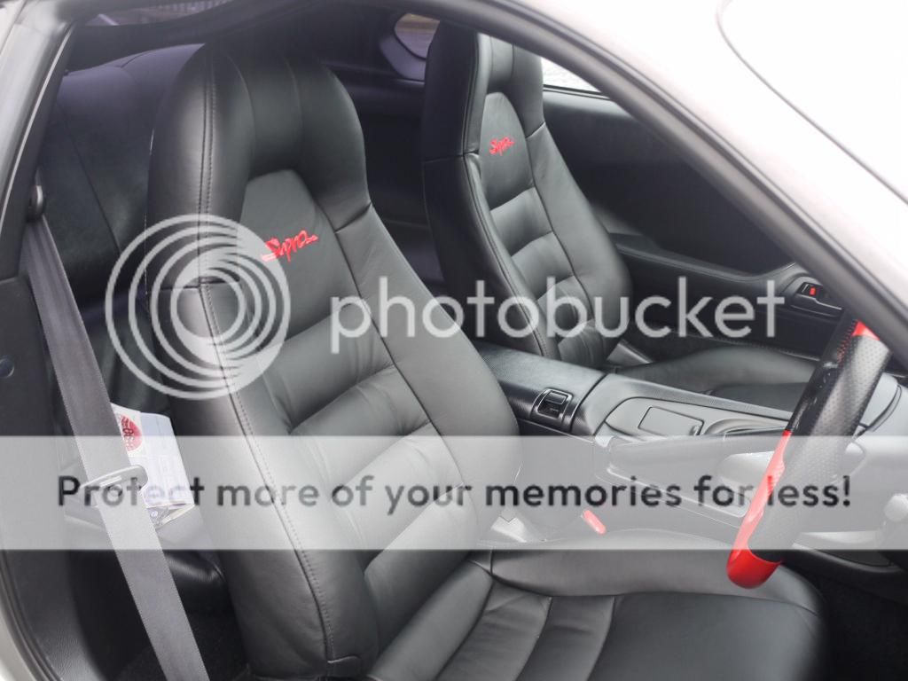 Pics of Black leather seats with red stitching?